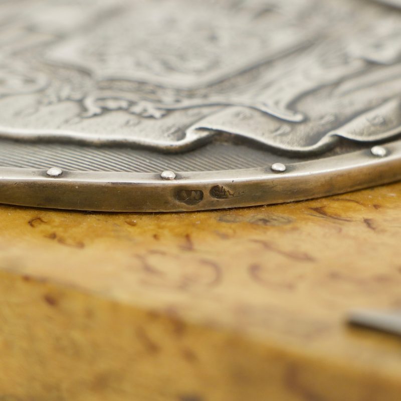Close-up of hallmarks on lid of wooden box with silver decorations made by Anders Nevalainen