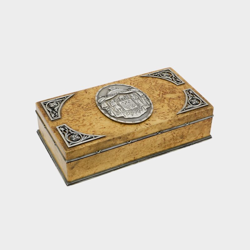 Faberge cigar box by Anders Nevalainen with silver coat of arms medallion in center of lid and four corner floral scrolls