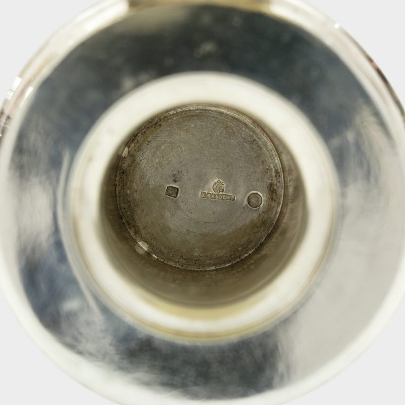 close-up of hallmarks on bottom of well inside Faberge cut-glass inkwell with silver domed lid open