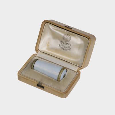 Faberge parasol handle by H. Wigstrom in original box, tapering cylindrical form, white enamel within gold chased leaf bands