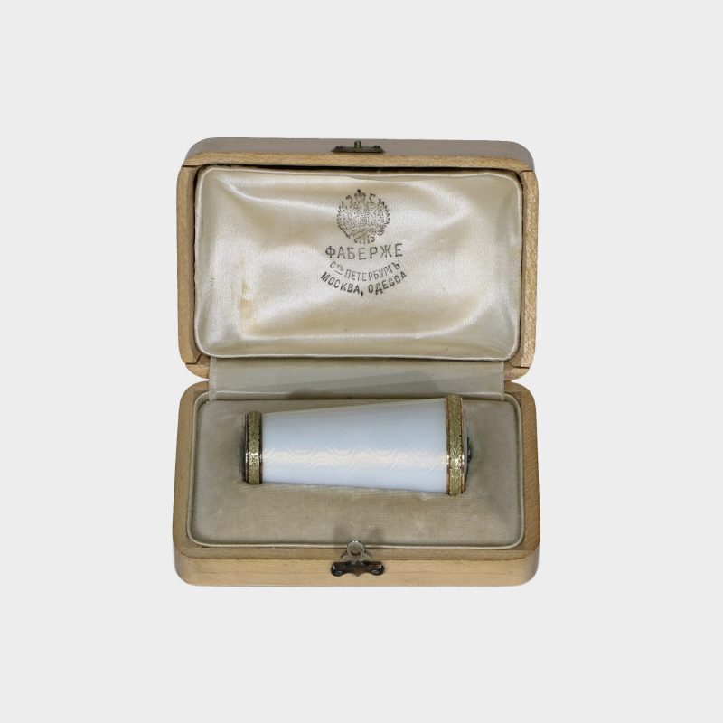 Faberge parasol handle by H. Wigstrom in original box, tapering cylindrical form, white enamel within gold chased leaf bands