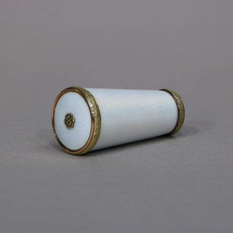 top view on Faberge parasol handle by H. Wigstrom, tapering cylindrical form, white enamel within gold chased leaf bands