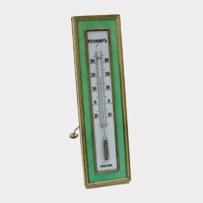Faberge thermometer by Karl Armfelt enameled in light green guilloche enamel within chased silver-gilt borders