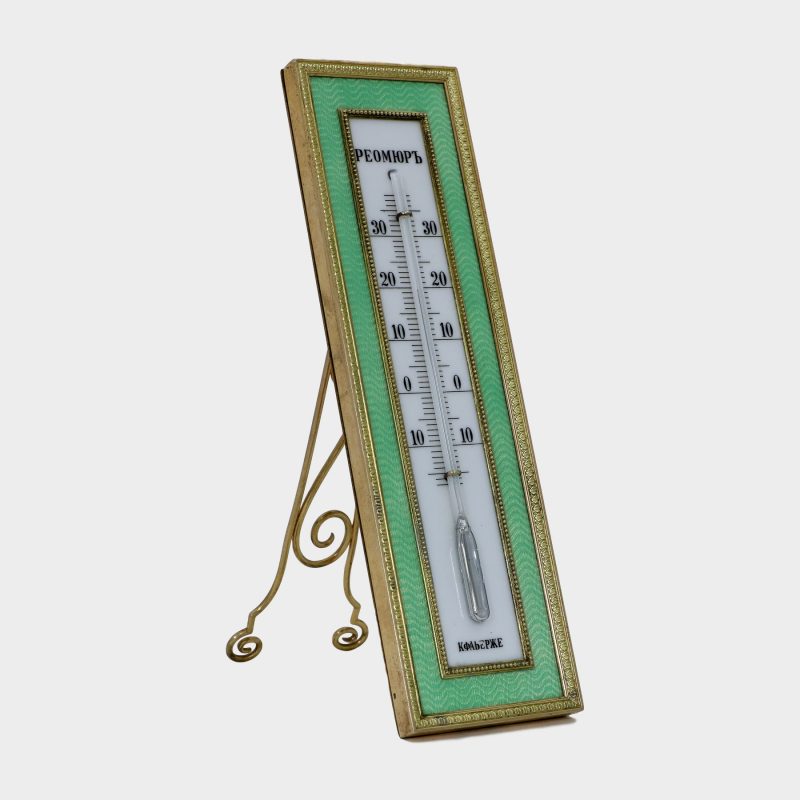 Faberge thermometer by Karl Armfelt enameled in light green guilloche enamel within chased silver-gilt borders
