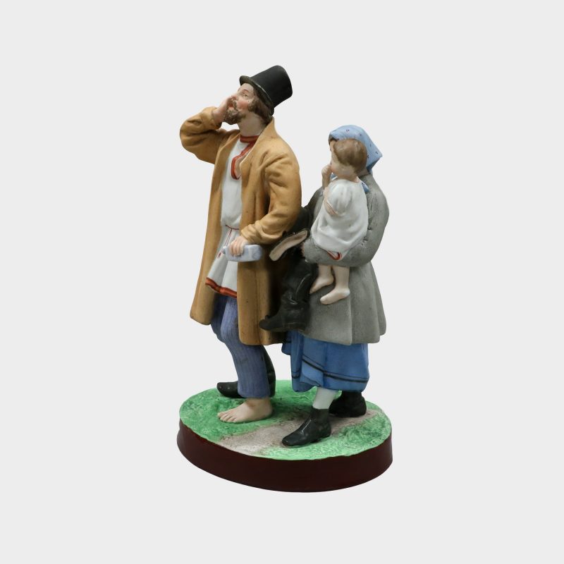 Gardner porcelain figure modeled as drunk man wearing one shoe, holding bottle and woman holding baby and man's other shoe
