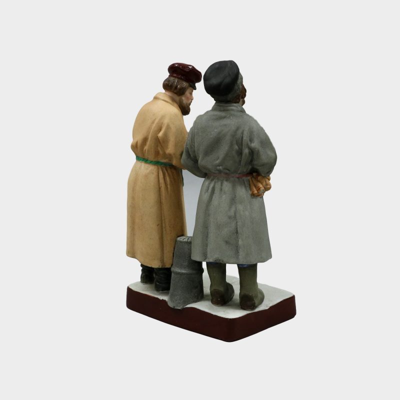 Gardner porcelain figure modeled as two peasants standing next to each other