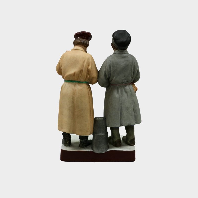 Gardner porcelain figure modeled as two peasants standing next to each other