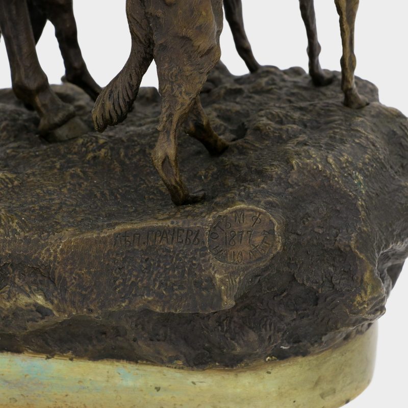close-up of signature on Russian bronze by Vasili Grachev of hunter on horseback smoking a pipe with two greyhounds