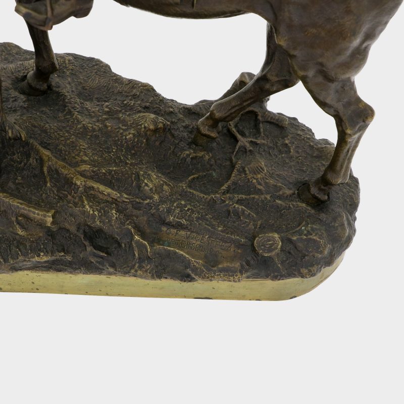 view on foundry mark on Russian sculpture of hunter on horseback smoking a pipe, with two greyhounds next to horse