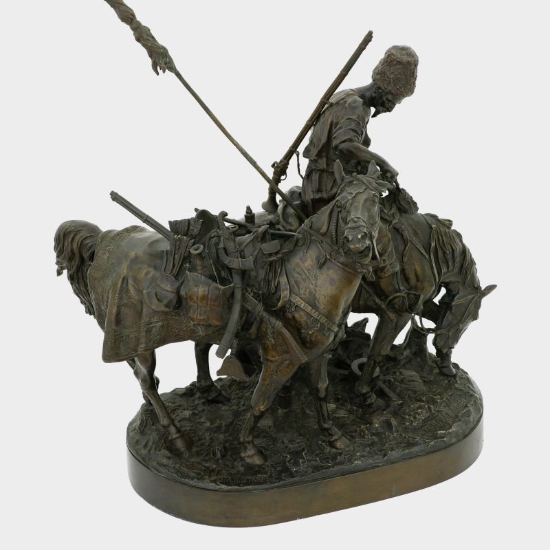 Lanceray bronze, cossack on horse wiping blood off his sword with his horse's mane, his enemy's horse tethered to his mount