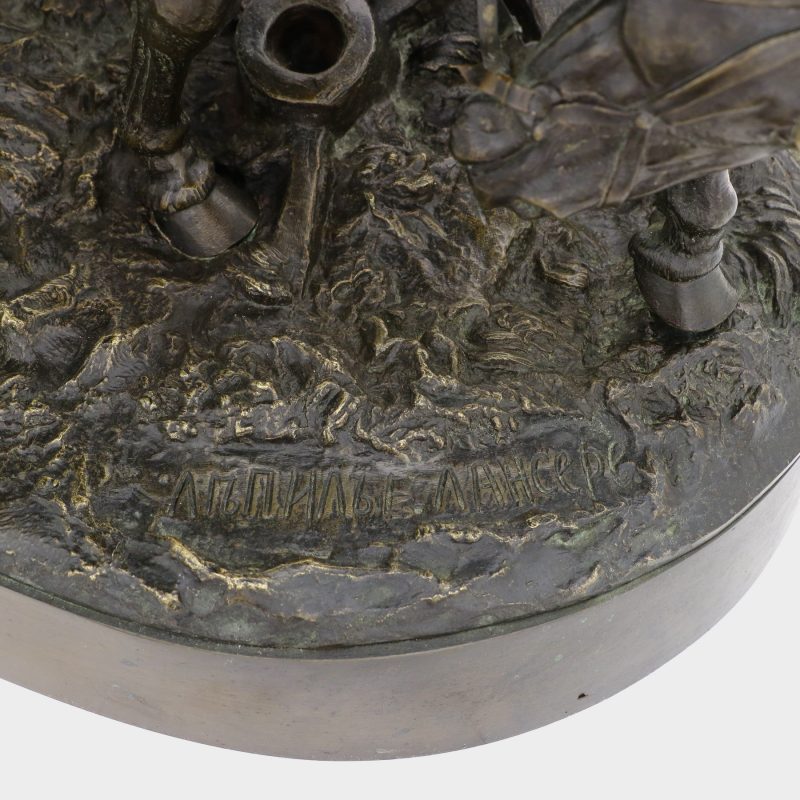 close-up of signature on Russian sculpture of cossack on horse wiping blood off his sword with his horse's mane