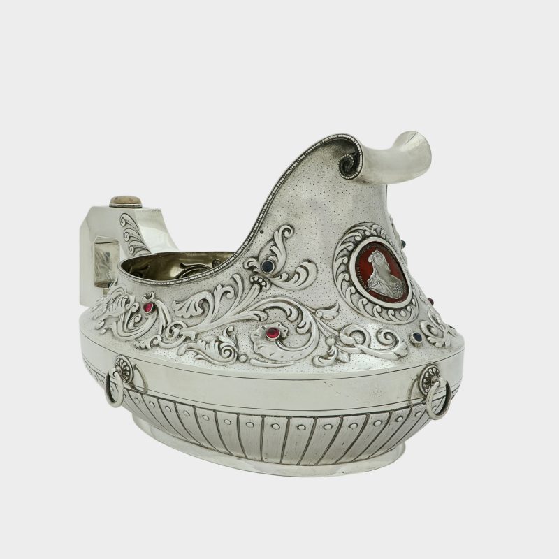 Large Russian silver kovsh, front centered by enameled coin of Empress Anna Ivanovna, handle set with oval hardstone boss