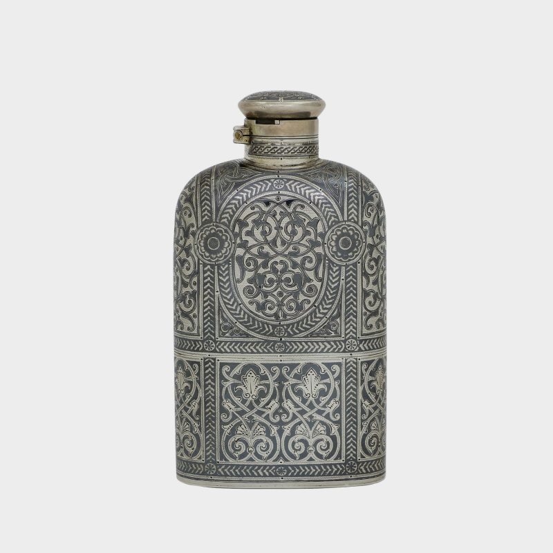 Russian silver flask by Antip Kuzmichev, retailed by Tiffany, compressed oval form, detachable base forming a beaker