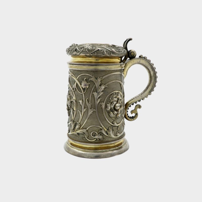 Russian silver tankard sides and domed lid decorated with scrolling foliage on stippled grounds, gilded interior