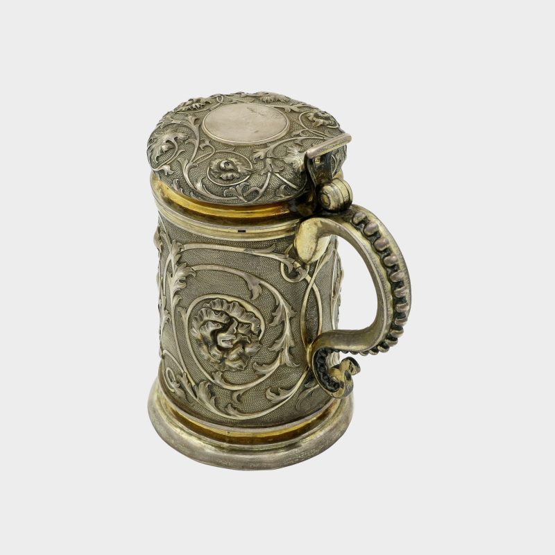 Russian silver tankard sides and domed lid decorated with scrolling foliage on stippled grounds, gilded interior
