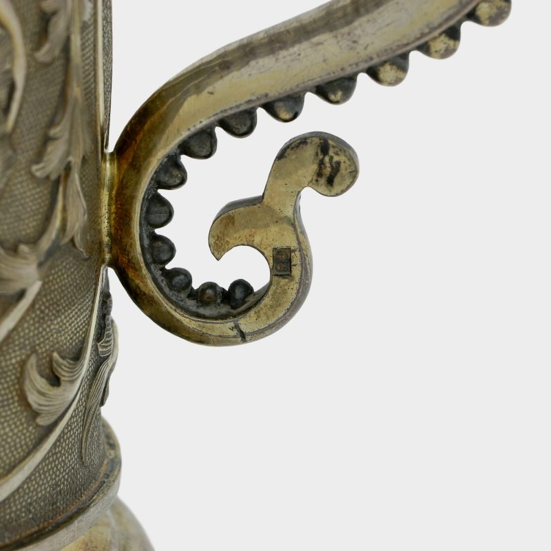 close-up of hallmarks on handle of Russian silver tankard decorated with scrolling foliage on stippled grounds