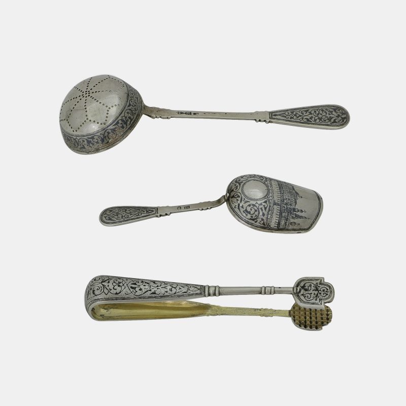 strainer, spoon and sugar tongs from Russian silver tea set, 7 piece silver niello set with views of Moscow