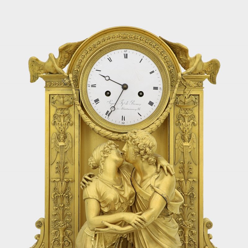 close-up of Claude Galle (Attributed) Empire gilt-bronze clock on marble base modeled as couple embracing each other