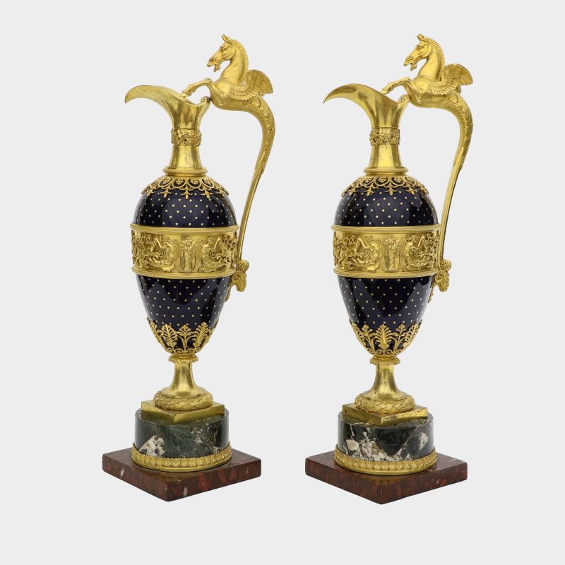 side view of pair of ewers, probably Russian, ovoid body enameled with stars, with Pegasus-formed ormolu handles