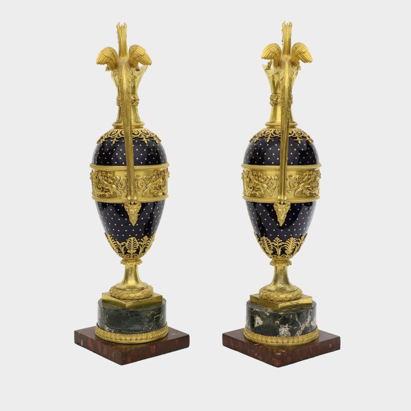 back view of pair of ewers, probably Russian, ovoid body enameled with stars, with Pegasus-formed ormolu handles