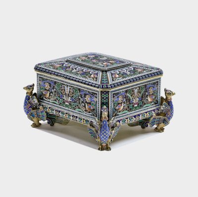 Russian silver and champleve enamel box by Pavel Ovchinnikov on four figural enameled feet shaped as peacocks