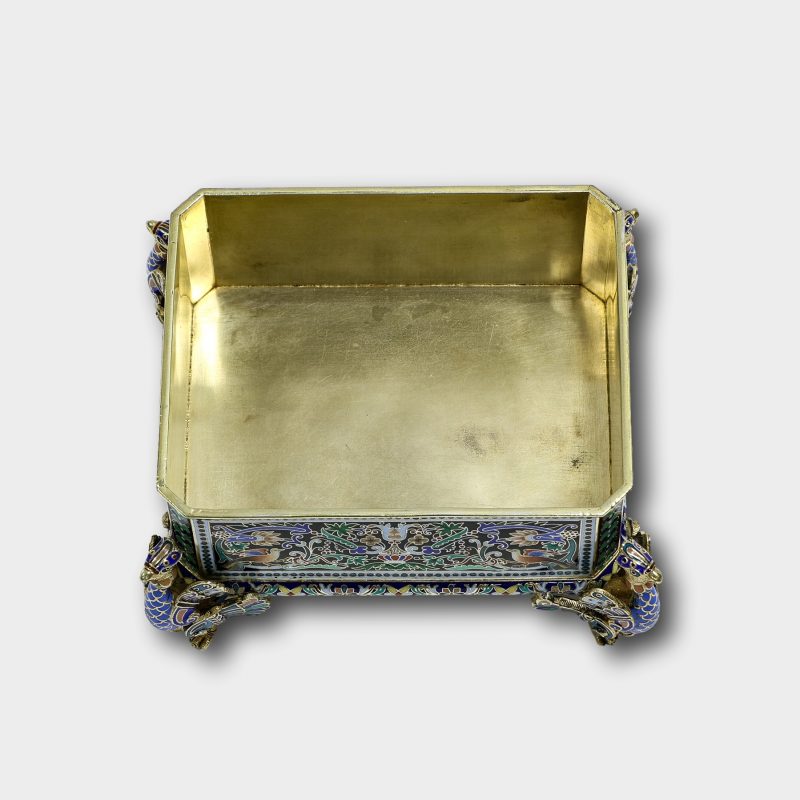interior of Russian silver and enamel box by Pavel Ovchinnikov on four figural enameled feet shaped as peacocks