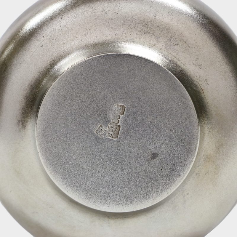 close-up of Hallmarks on bottom of antique Russian silver ladle with matte finish surface