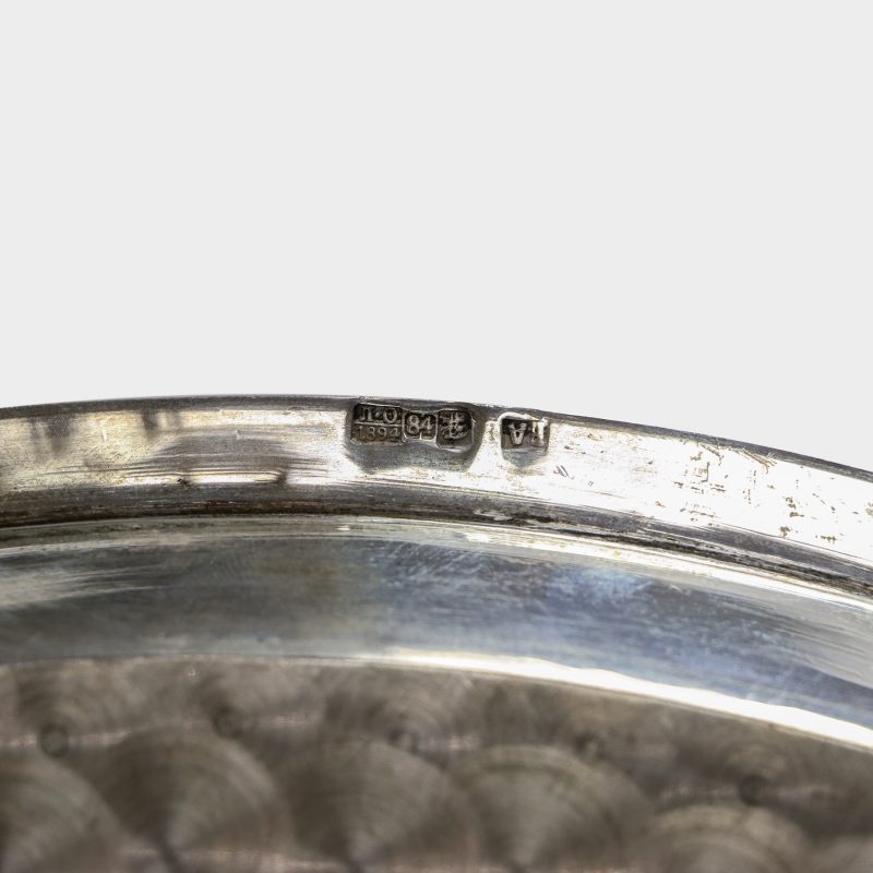 Close-up of hallmarks on tray from antique Russian silver punch service