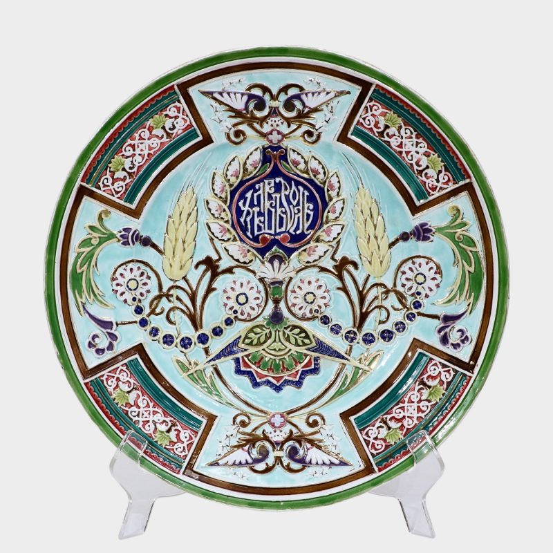 Russian faience charger by Kuznetsov Porcelain Factory, decorated with raised floral ornament on pale blue background
