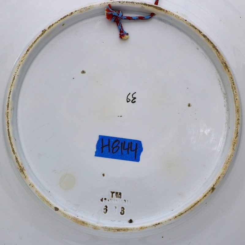 close-up of Kuznetsov Porcelain Factory mark on large ceramic charger