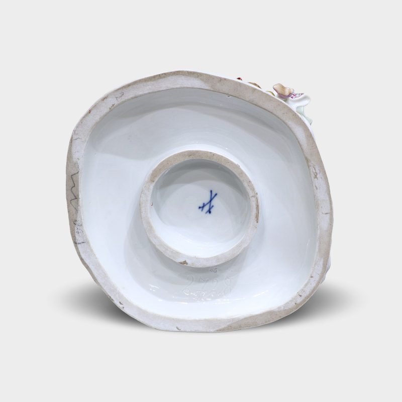 bottom of base with blue crossed swords mark of porcelain figurine "Ring around the Rosie"