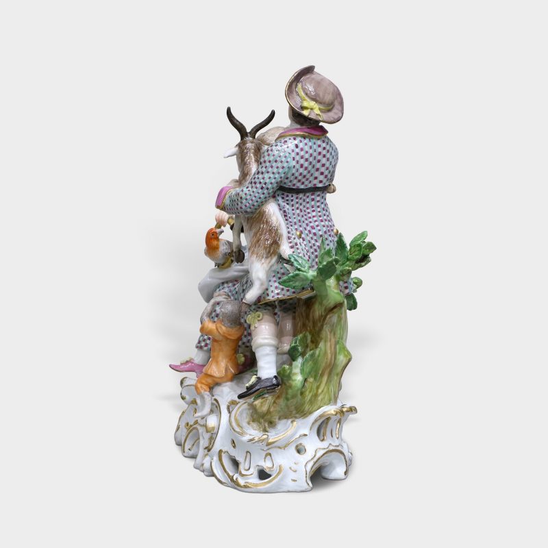 side view on Meissen porcelain figurine modeled as elegant couple with animals emblematic of Sense of Hearing