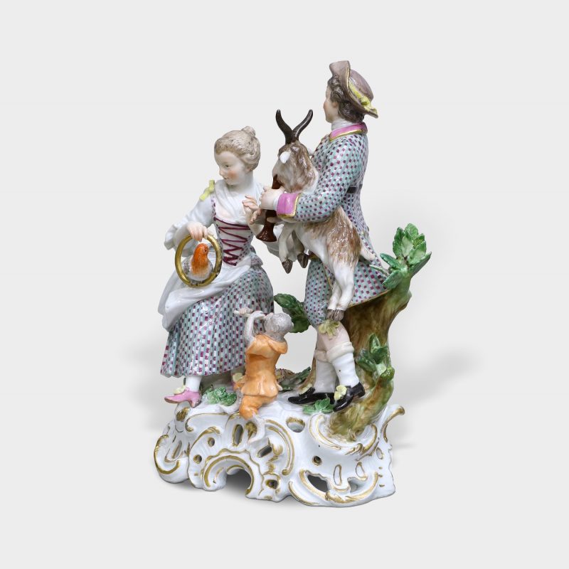 Meissen porcelain figurine modeled as elegant couple with animals playing musical instruments emblematic of Sense of Hearing