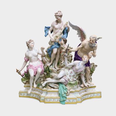 Meissen porcelain group modeled with five figures standing upon a rocky stepped trapezoidal gilt-enriched base