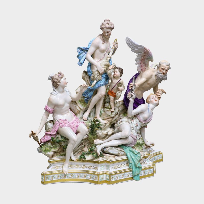 side view of Meissen porcelain group modeled with five figures standing upon rocky stepped trapezoidal gilt-enriched base