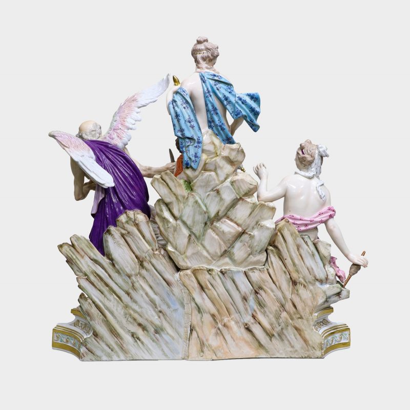 back view Meissen porcelain group modeled with five figures standing upon rocky stepped trapezoidal gilt-enriched base