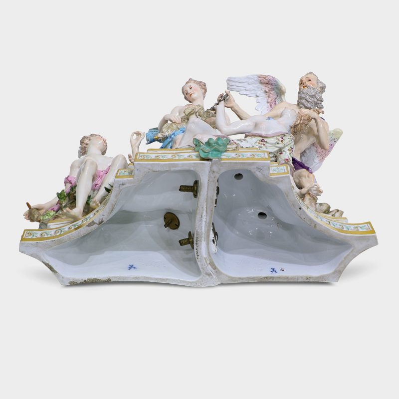 bottom of base of porcelain group modeled with five figures standing upon rocky stepped trapezoidal gilt-enriched base