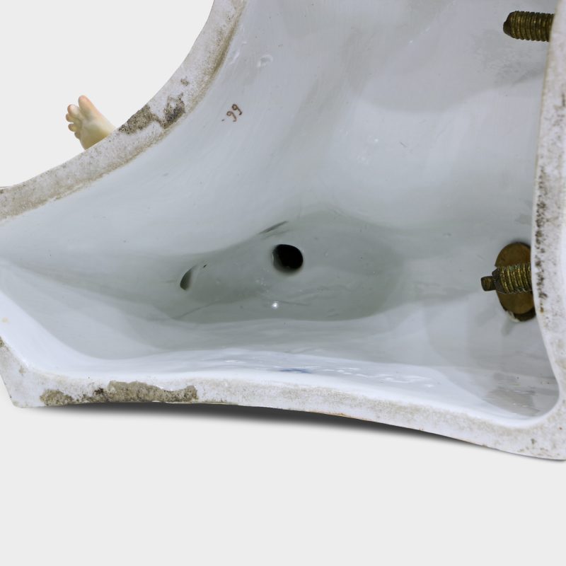 Close-up of bottom of base of porcelain sculpture