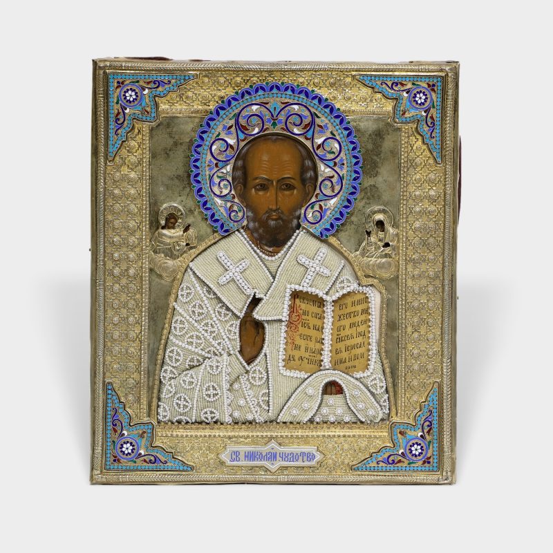 Antique Russian icon of St. Nicholas The Miracle Worker in silver-gilt Riza with enamel corners by Petr Milyukov