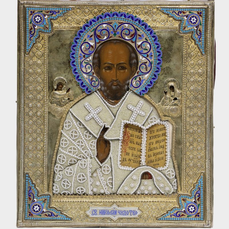 close-up of Antique icon of St. Nicholas The Miracle Worker in silver-gilt Riza with enamel corners by Petr Milyukov